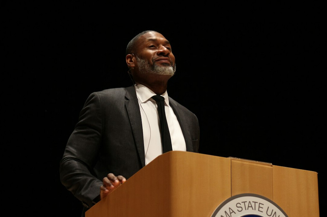 confident speaker on podium